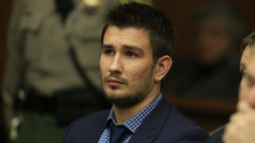 Kings defenseman Slava Voynov sits in court after pleading not guilty to a felony domestic violence charge on Dec. 1.