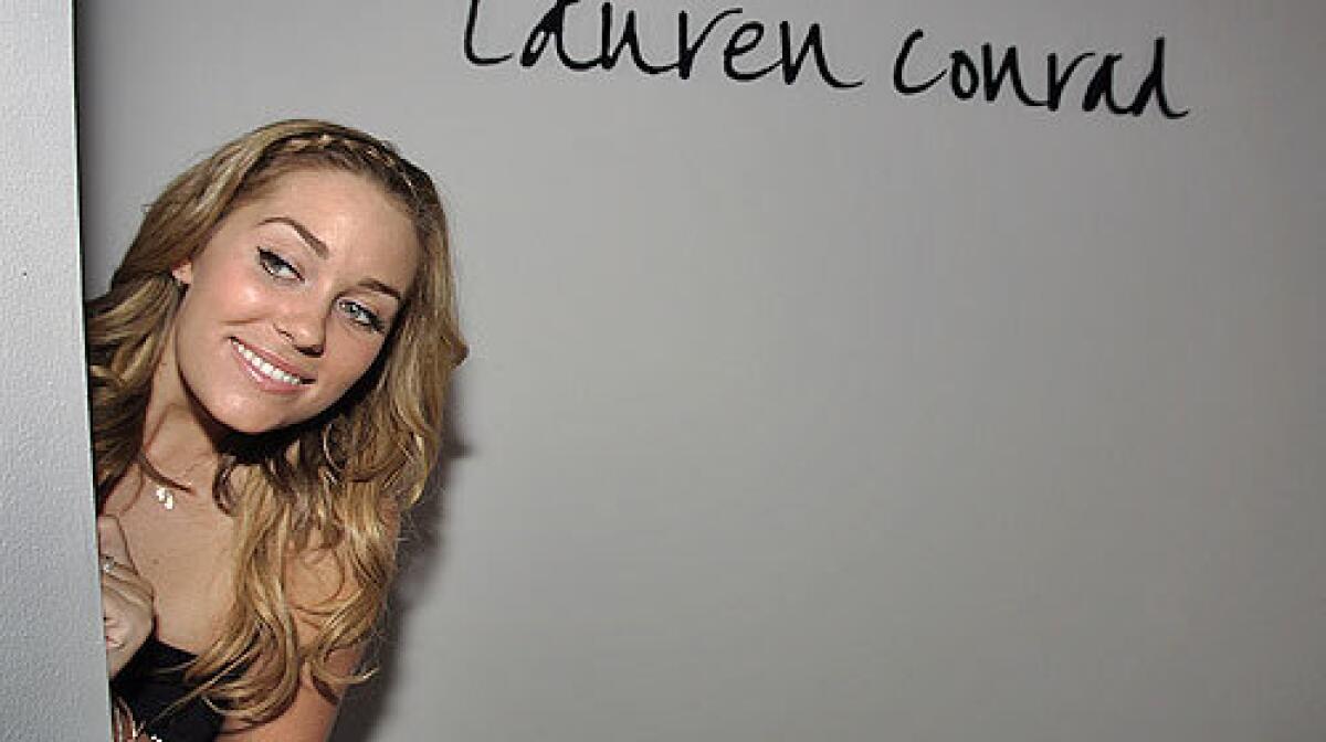 Lauren Conrad, peeking at the gathering crowd before her show, will create a dress for this years Emmys.
