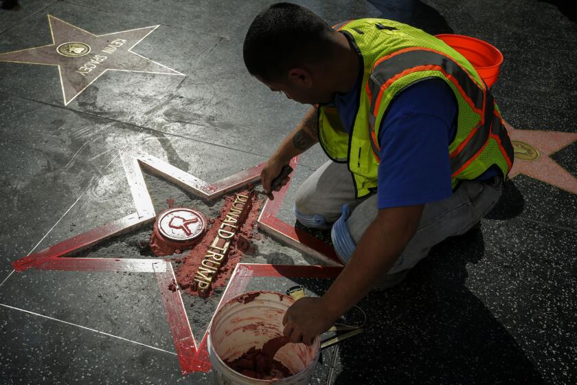 A new Donald Trump star on the Hollywood Walk of Fame is installed after it was vandalized.