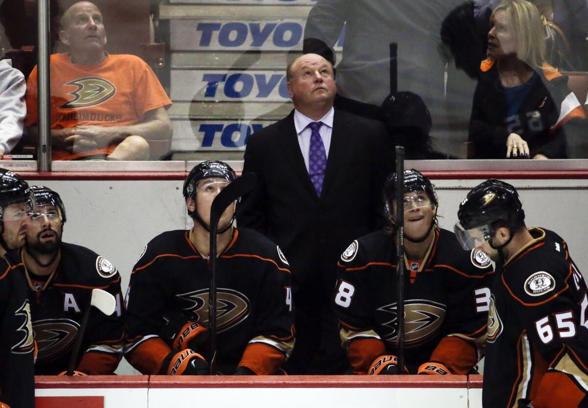 Ducks Coach Bruce Boudreau looks up at the scoreboard during the third period of a 4-0 loss to the Coyotes on Tuesday at the Honda Center.
