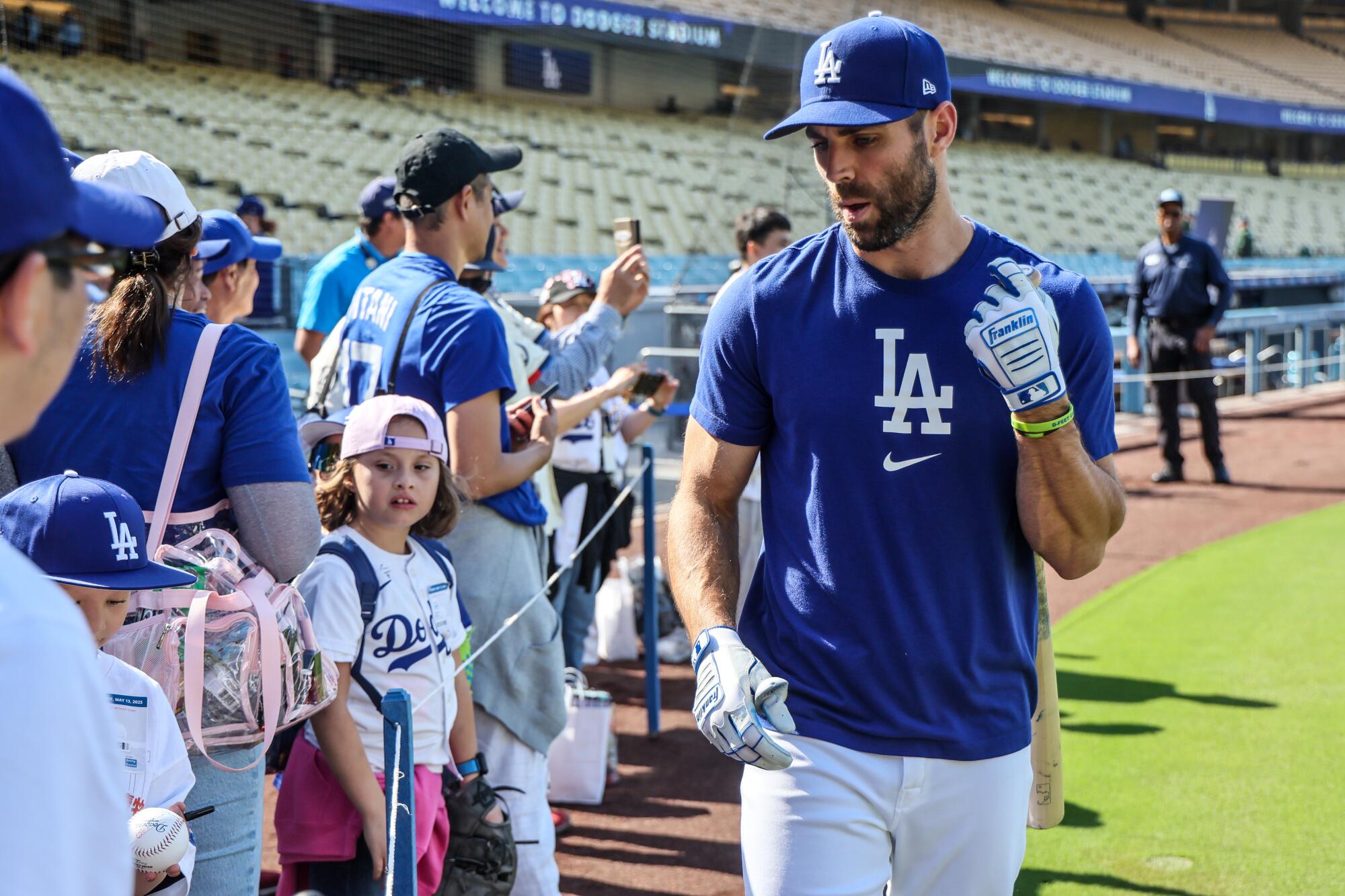 Dodgers outfielder Chris Taylor greets fans before a game against the Athletics at Dodger Stadium Tuesday.