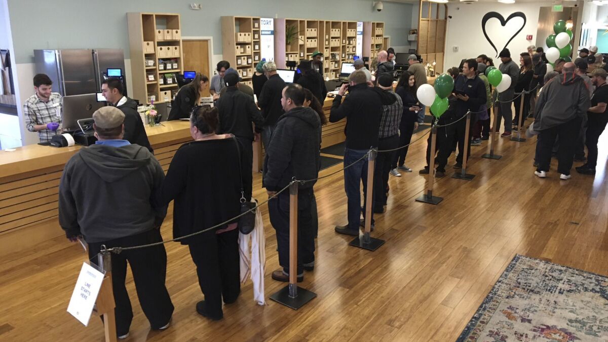 Customers line up inside a cannabis dispensary in Oakland, Calif. on Jan. 4, 2018.