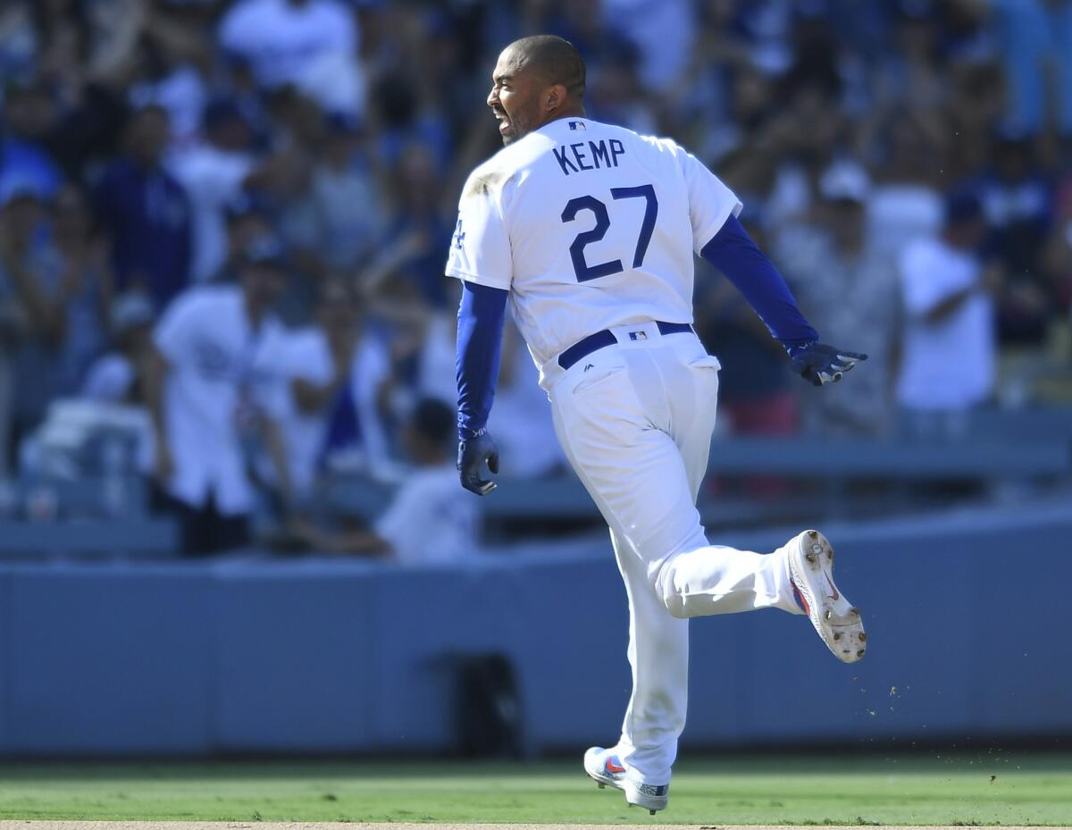 Matt Kemp #27 of the Los Angeles Dodgers runs toward third base after a walkoff double against Brad Boxberger #31 of the Arizona Diamondbacks for a 3-2 win at Dodger Stadium on September 2, 2018 in Los Angeles, California.