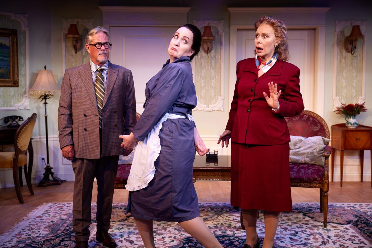 Three actors in a scene from North Coast Repertory Theatre's "The Angel Next Door."