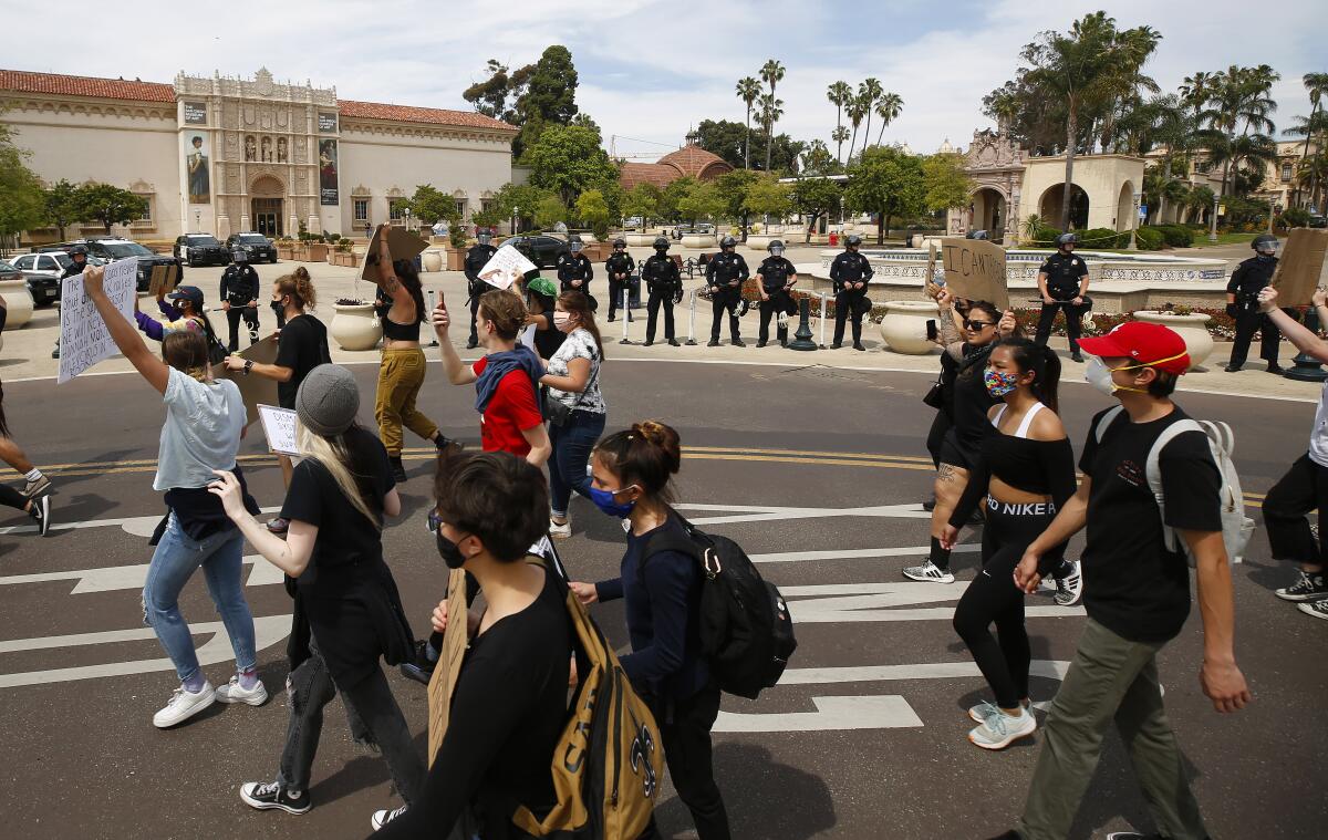 Youth peacefully march through Balboa Park in June 2020, protesting after the in-custody death of George Floyd.