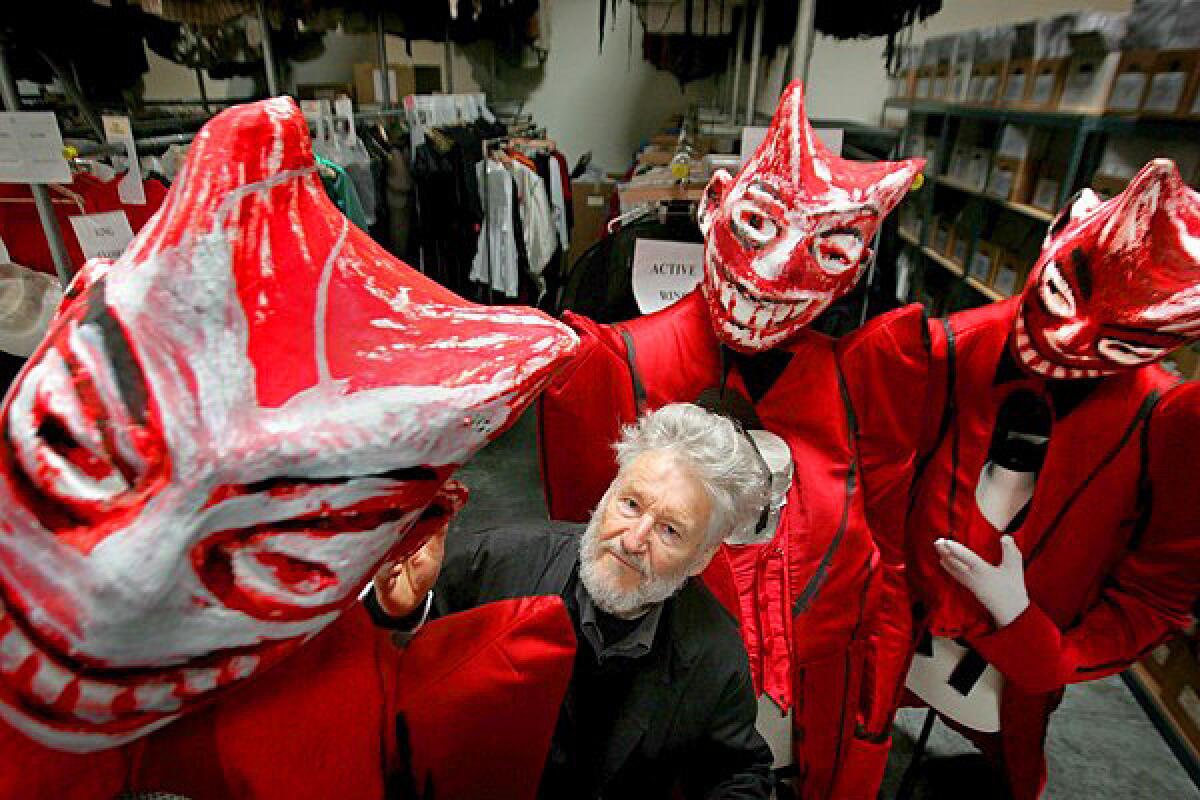 Achim Freyer, director of the Ring cycle for L.A. Opera, is surrounded by costumes for "Gotterdammerung," the next opera upcoming in the series at Dorothy Chandler Pavilion.