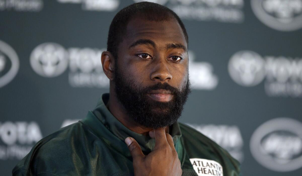 New York Jets cornerback Darrelle Revis gives a press conference after an NFL training session in London on Oct. 2.