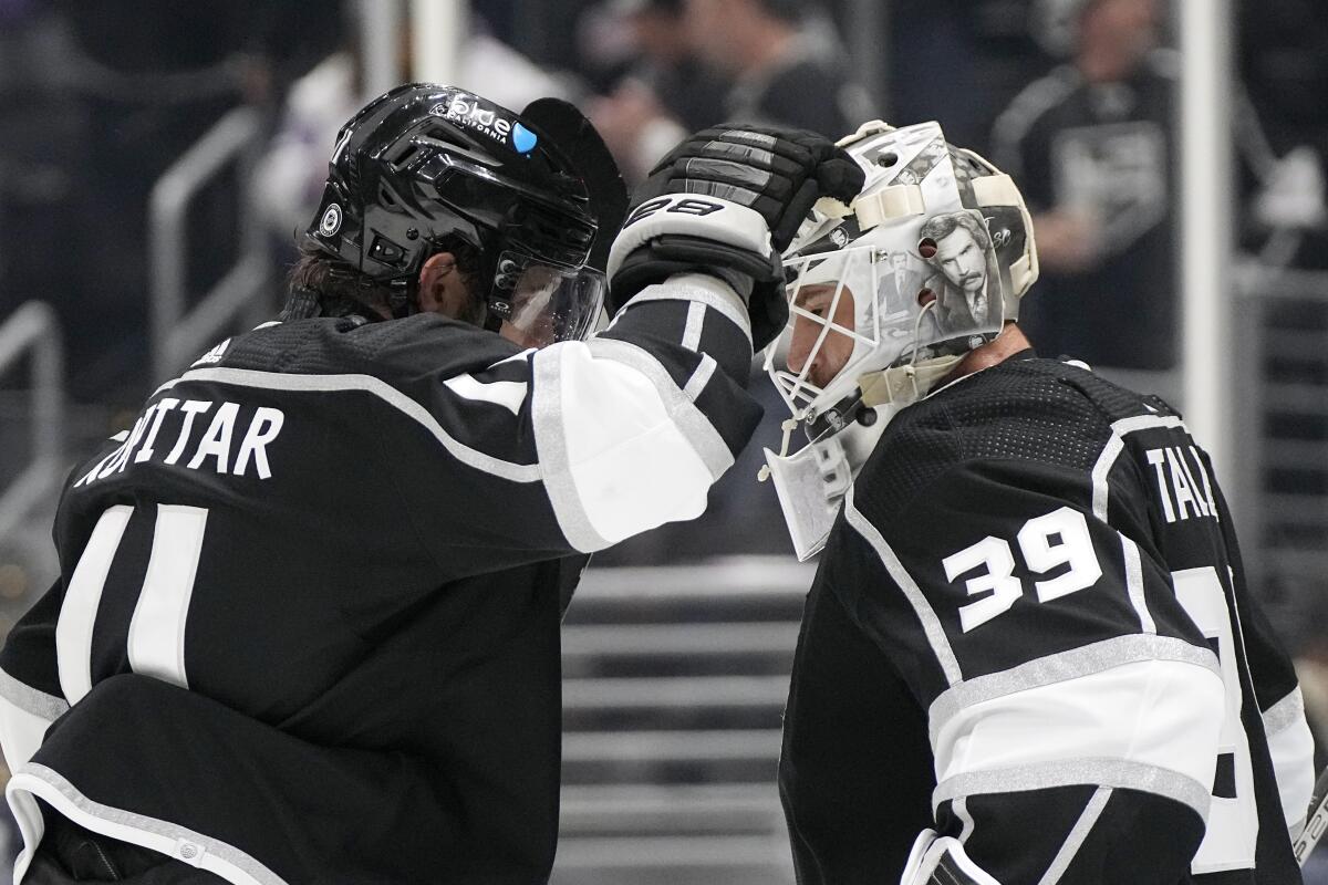 Kings captain Anze Kopitar, left, congratulates goaltender Cam Talbot after the Kings defeated the Florida Panthers.