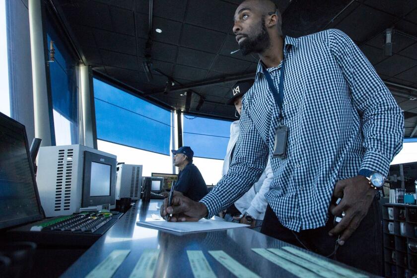 LOS ANGELES, CALIF. -- FRIDAY, JUNE 24, 2016: Air traffic controllers direct aircraft in the control tower cab at LAX during a press event in Los Angeles, Calif., on June 24, 2016. Brian van der Brug / Los Angeles Times)