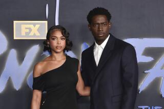 Lori Harvey, left, and Damson Idris arrive at the premiere of the sixth and final season of "Snowfall" 