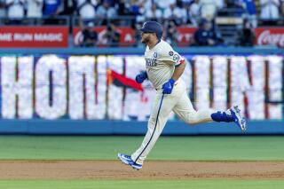 Max Muncy runs the bases after hitting a two-run homer off San Francisco Giants pitcher Kai-Wei Teng.