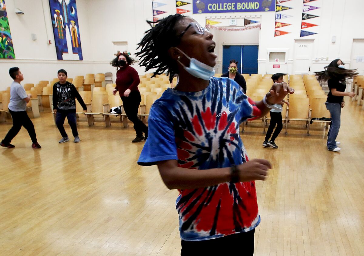 Students in a dance class in the auditorium of an LA elementary school.