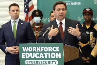 Florida Gov. Ron DeSantis gestures during a news conference after announcing a program to create cybersecurity opportunities.