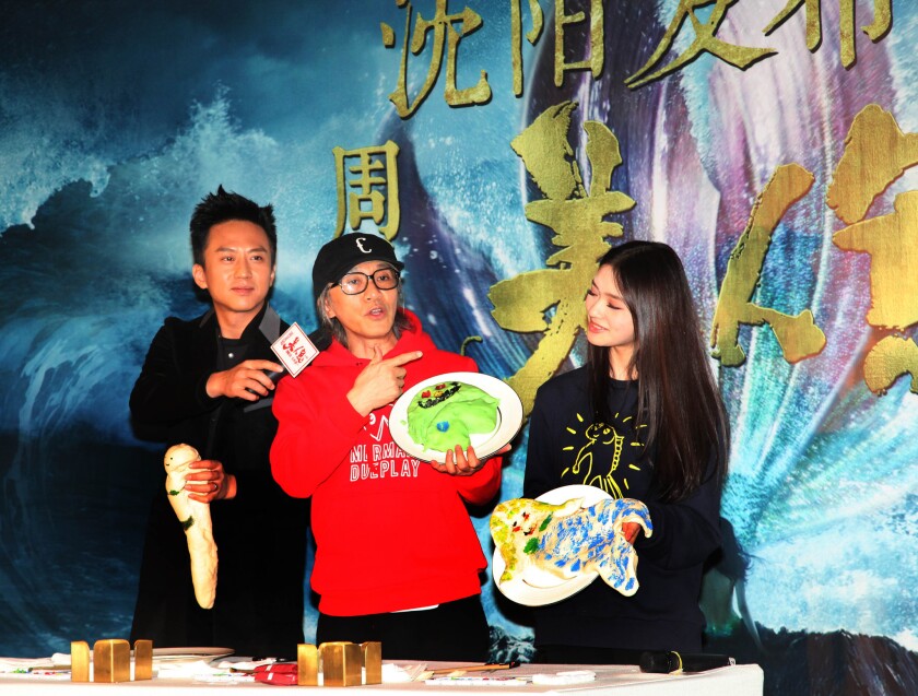 From left to right, actor Deng Chao, director and actor Stephen Chow and actress Lin Yun promote "The Mermaid" in Shenyang, China, on Jan. 30.