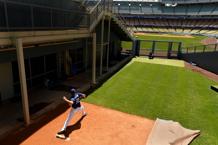LOS ANGEL;ES, CALIFORNIA APRIL 8, 2021-Dodgers starting pitcher Clayton Kershaw throws a pitch in the bullpen during a workout at Dodger Stadium Thursday. (Wally Skalij/Los Angeles Times)
