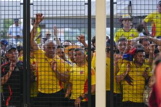 Fans wait to enter the stadium prior to the Copa America final soccer match.