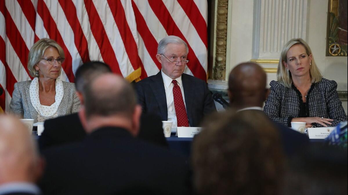 Education Secretary Betsy DeVos, from left, Atty. Gen. Jeff Sessions and Homeland Security Secretary Kirstjen Nielsen participate in a panel discussion on improving school safety.