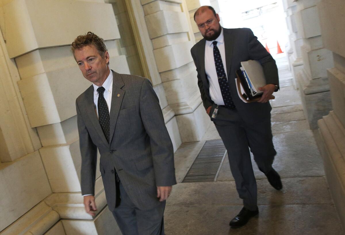 Sen. Rand Paul enters the Capitol before speaking on the Senate floor on Oct. 29.