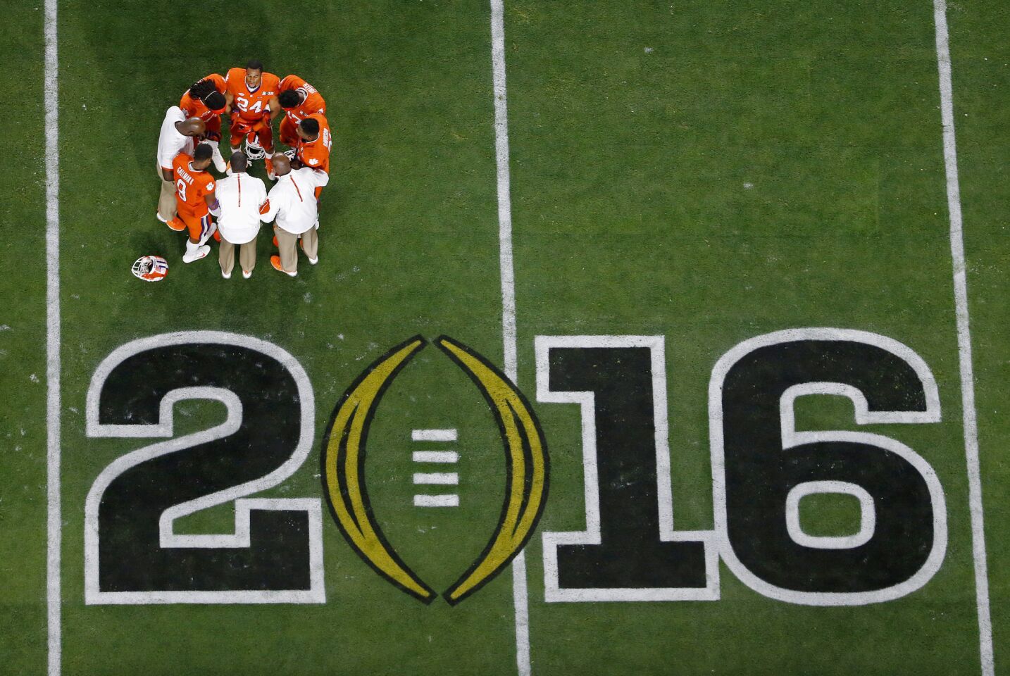 Clemson players huddle before the 2016 College Football Playoff championship game against Alabama.