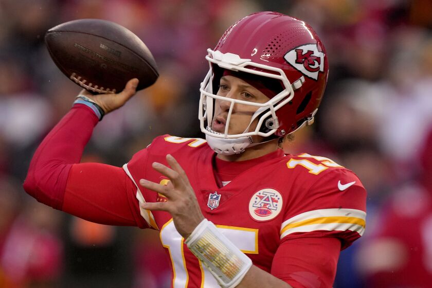 Kansas City Chiefs quarterback Patrick Mahomes throws during the first half of an NFL divisional round.