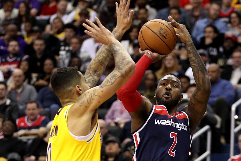 WASHINGTON, DC - DECEMBER 16: John Wall #2 of the Washington Wizards shoots against the Los Angeles Lakers during the second half at Capital One Arena on December 16, 2018 in Washington, DC. NOTE TO USER: User expressly acknowledges and agrees that, by downloading and or using this photograph, User is consenting to the terms and conditions of the Getty Images License Agreement. (Photo by Patrick Smith/Getty Images) ** OUTS - ELSENT, FPG, CM - OUTS * NM, PH, VA if sourced by CT, LA or MoD **