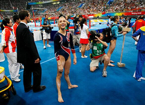 U.S. gymnast Nastia Liukin seems to be in good spirits after learning that she won the silver medal in uneven bars. She had the same score as China's He Kexin, who took the gold.