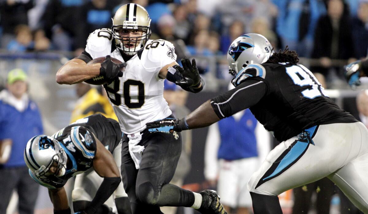 Saints tight end Jimmy Graham (80) runs past Panthers defensive tackle Colin Cole (91) in the second half Thursday night.