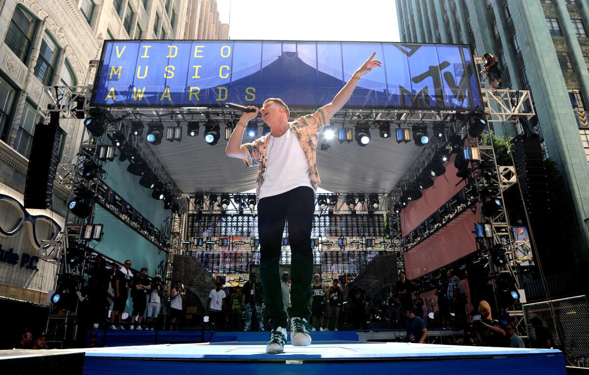 Macklemore rehearses for MTV's Video Music Awards.