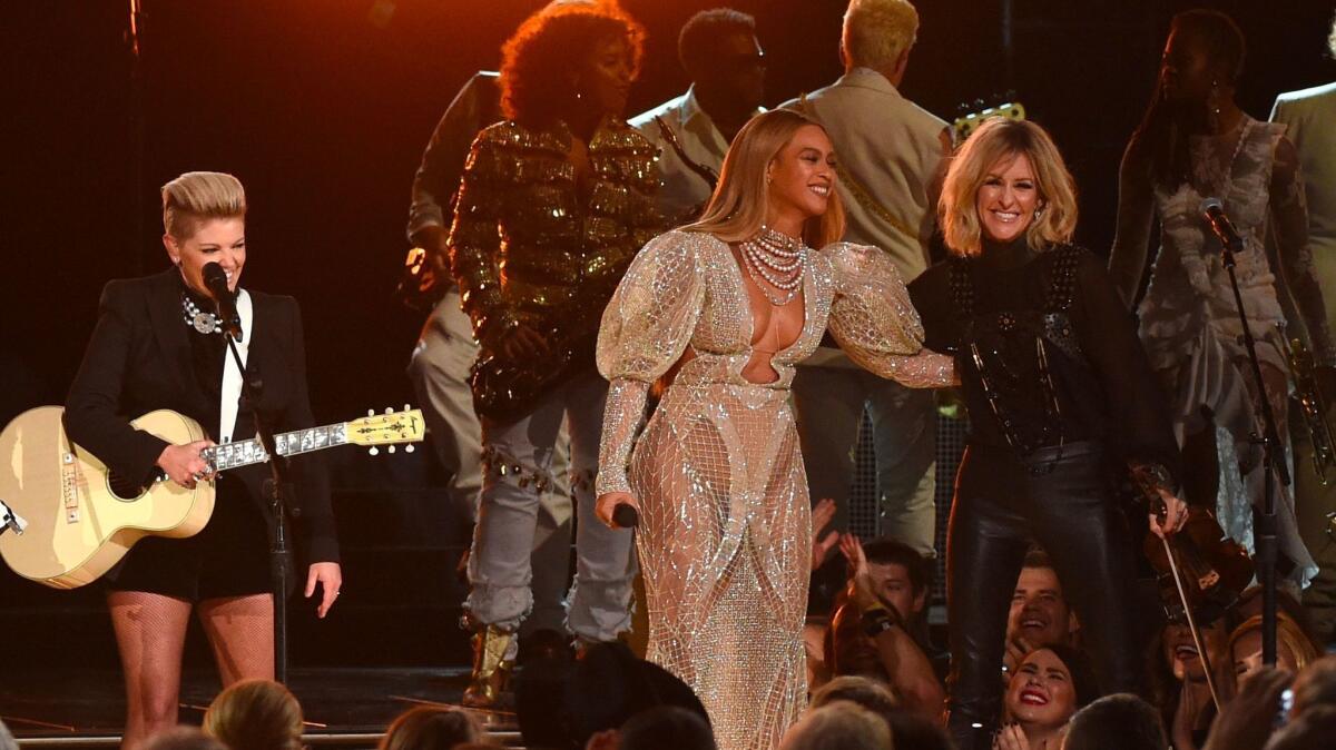 Beyoncé, center, performs with the Dixie Chicks during Wednesday's CMA Awards in Nashville.