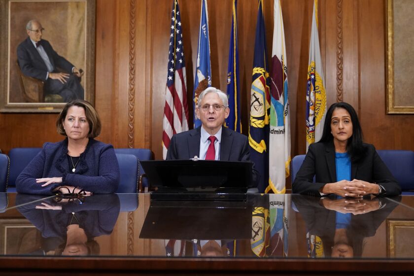 Attorney General Merrick Garland speaks at a news conference about the Justice Department's intervention to try to bring improvements to the beleaguered water system in Jackson, Miss., at the Justice Department in Washington, Wednesday, Nov. 30, 2022. At left is Deputy Attorney General Lisa Monaco and Associate Attorney General Vanita Gupta, right. (AP Photo/Patrick Semansky)