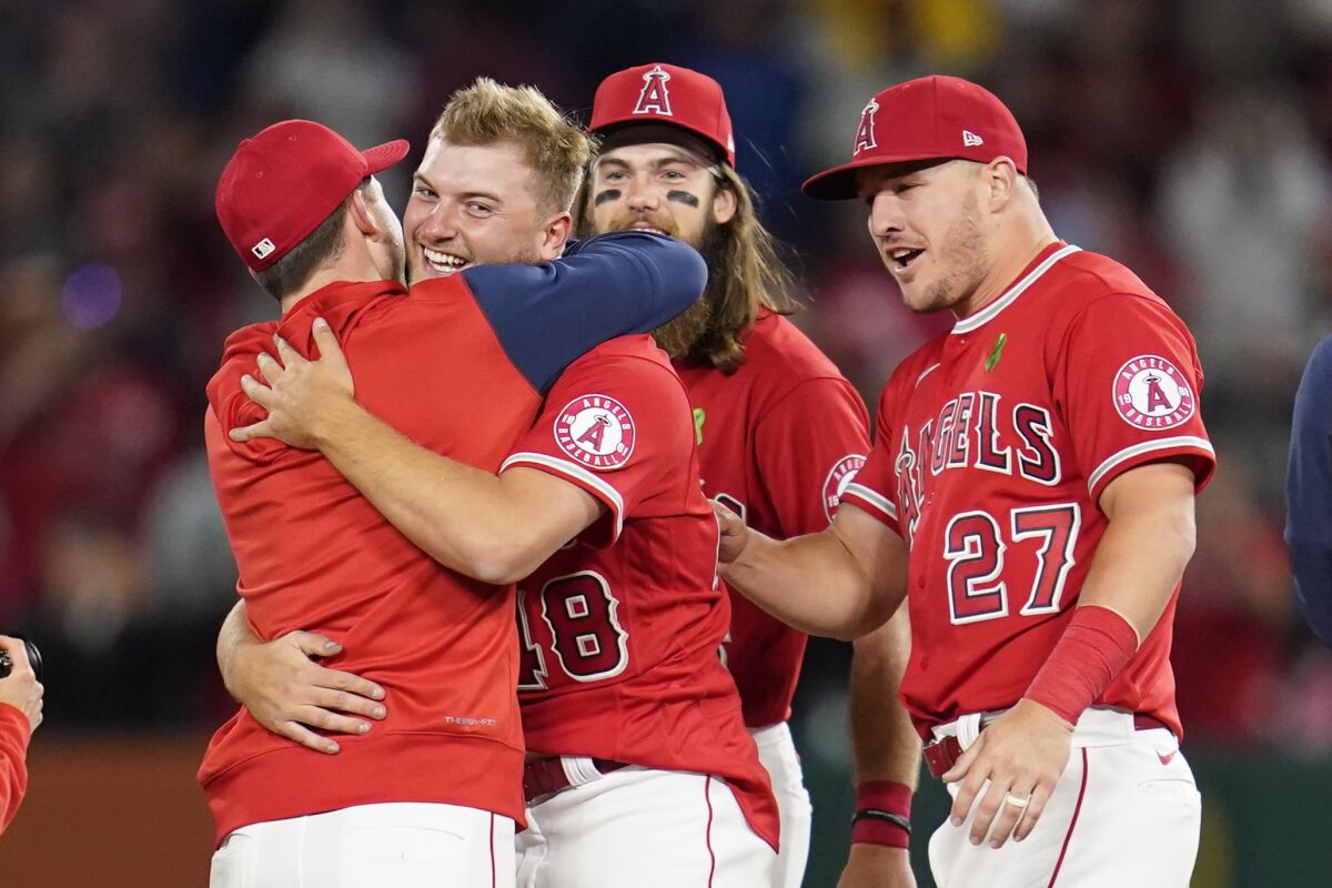 Angels rookie Reid Detmers (48) celebrates with teammates after throwing a no-hitter against the Tampa Bay Rays on Tuesday.