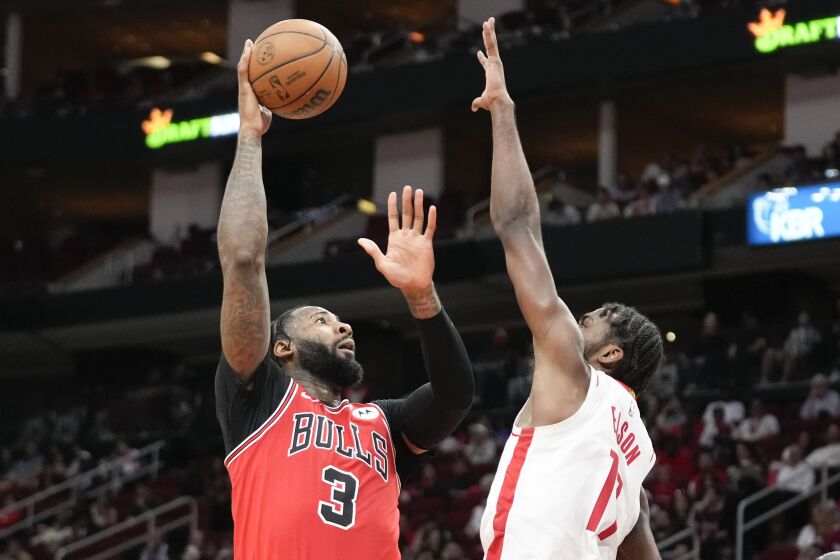 Chicago Bulls center Andre Drummond (3) shoots as Tari Eason defends during the second half of an NBA basketball game, Saturday, March 11, 2023, in Houston. (AP Photo/Eric Christian Smith)