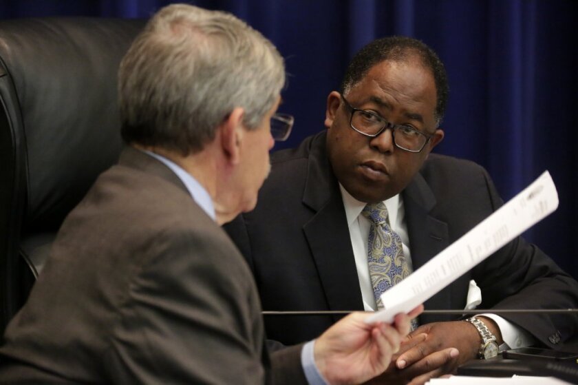 Los Angeles County Supervisors Mark Ridley-Thomas and Zev Yaroslavksy, left, confer at a board meeting. Ridley-Thomas is pushing to renovate a former courthouse in Culver City as an arts center.