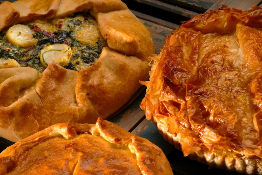 Greens and potato torta (back left), Provencal Pumpkin torta (center bottom) and Greek winter squash and leek pie.