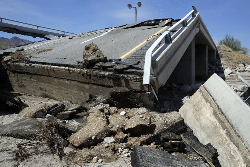 The eastbound bridge of Interstate 10 between Coachella and the Arizona border lies in ruins after yesterday's flash floods washed out the bridge over a desert wash. Traffic in both directions of the major east-west highway has been stopped indefinitely while engineers assess the damage.