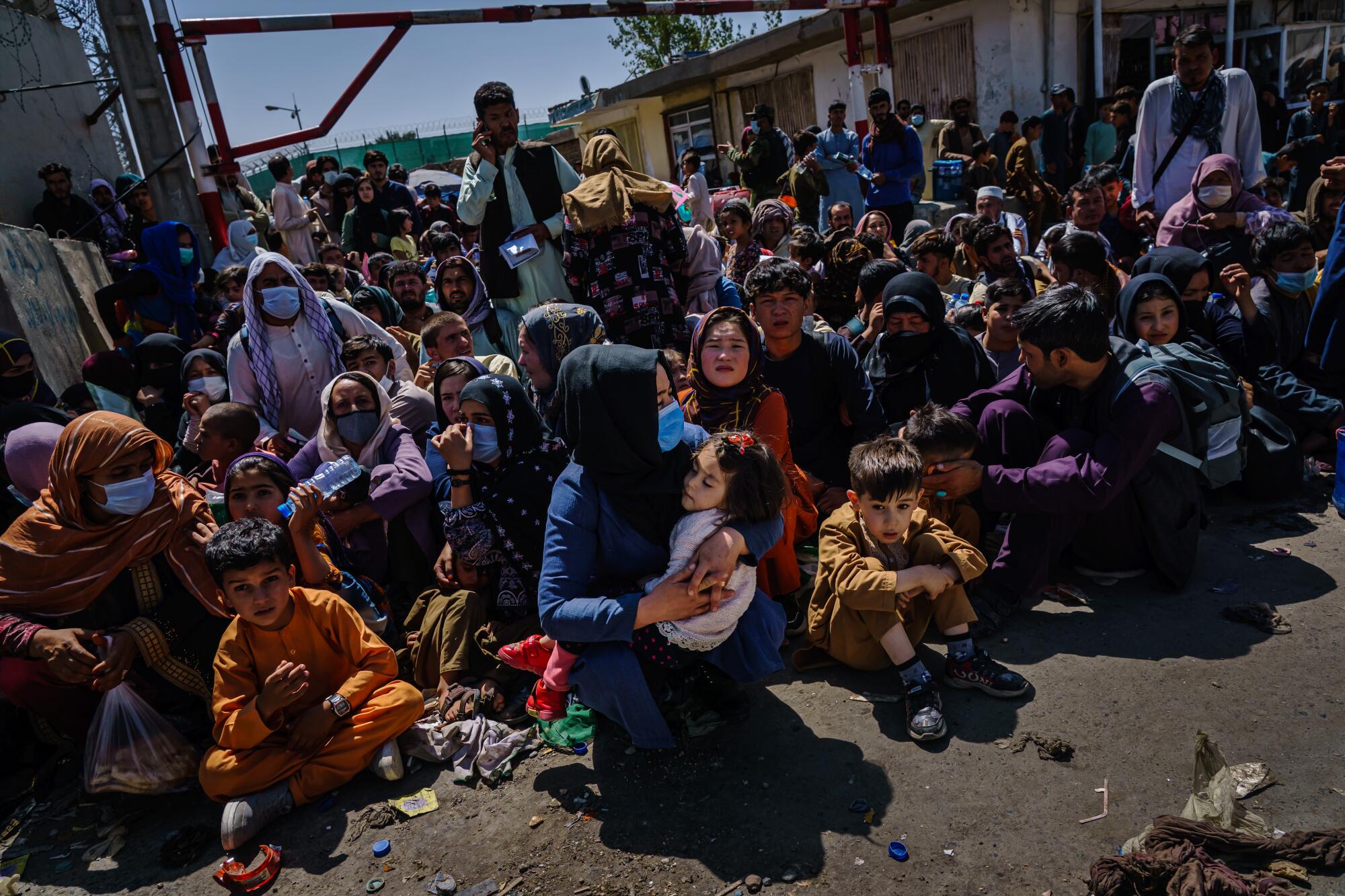 Women and children aoutside the Taliban controlled check point near the Abbey Gate.