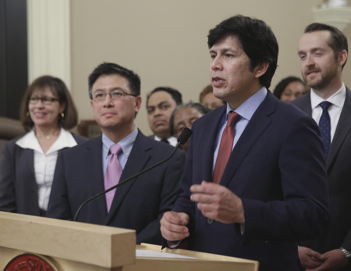 State Senate President Pro Tem Kevin de Leon, D-Sacramento, accompanied by state Treasurer John Chiang, discusses a proposal to automatically enroll-private sector workers in a state-run retirement account during a news conference in Sacramento on March 28.