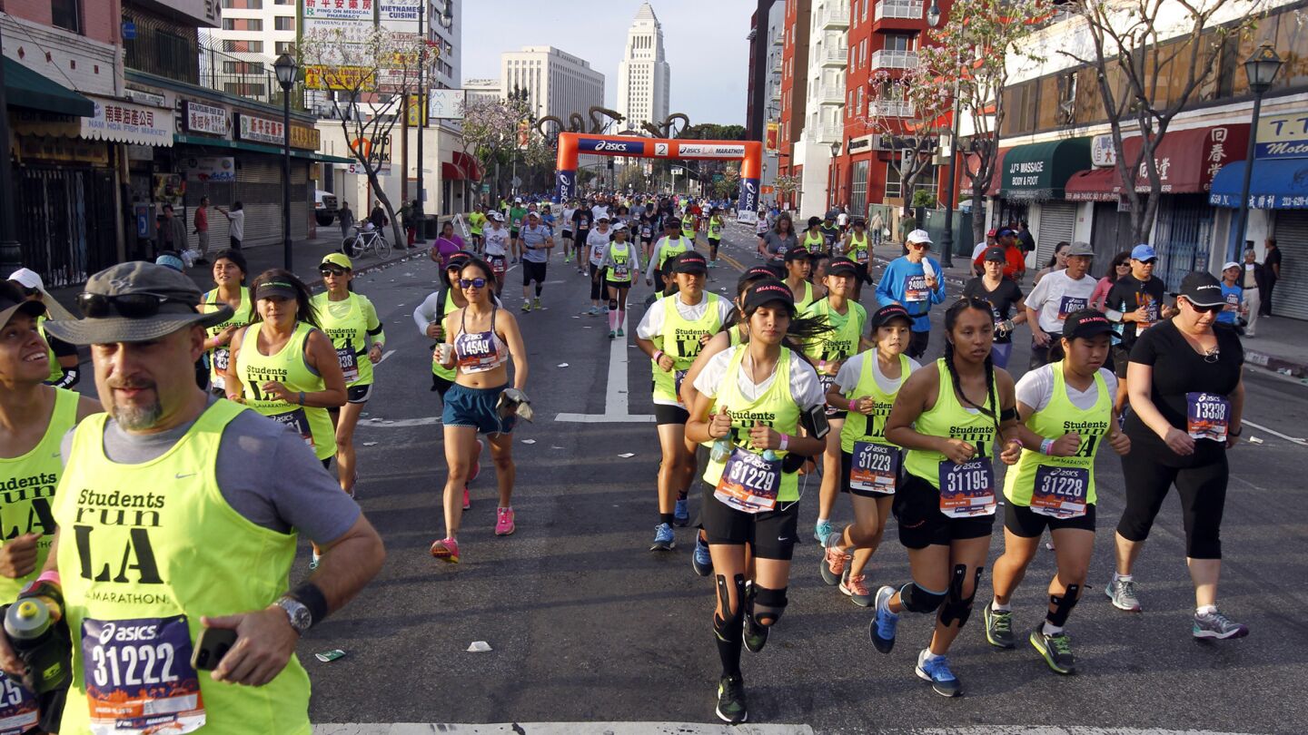 Runners pass through Chinatown during 30th Los Angeles Marathon.