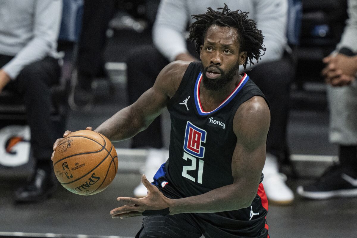 Patrick Beverley runs with the ball in a Clippers uniform.
