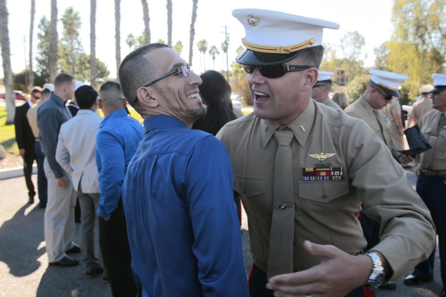 Marine veteran Joel Jimenez, left, and 1st Lt. Dan Dinneen, who were together during the Second Battle of Fallujah, greet after they arrived.
