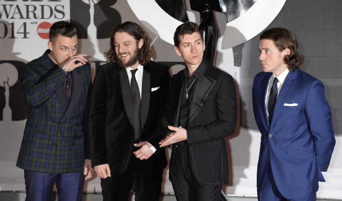 Arctic Monkeys arrives Wednesday at the Brit Awards in London, where it won prizes for album and British group of the year.
