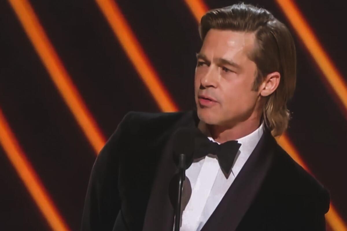 Brad Pitt accepts his award for supporting actor at the 92nd Academy Awards ceremony in Los Angeles.