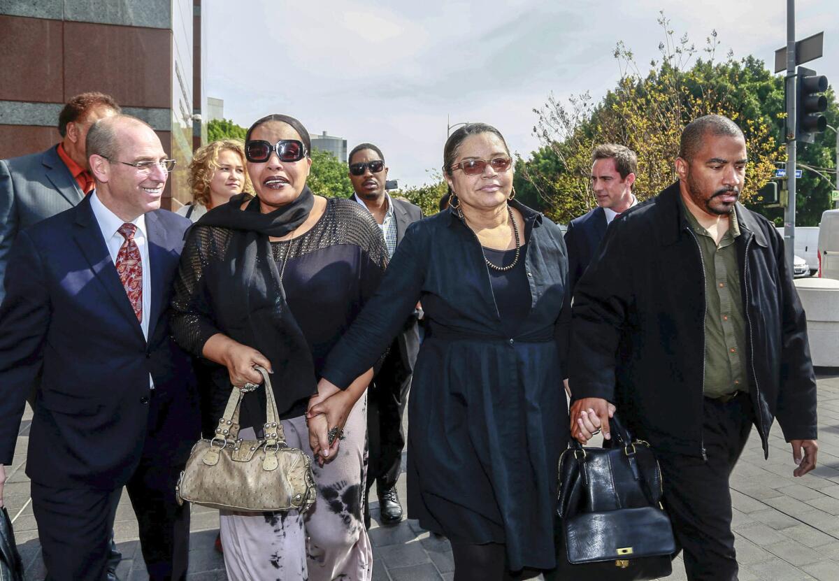 Attorney Mark Levinsohn, left, walks with Marvin Gaye's family members, from left, daughter Nona Gaye, ex-wife Jan Gaye, and son Frankie Gaye, outside the downtown Los Angeles court building March 10.