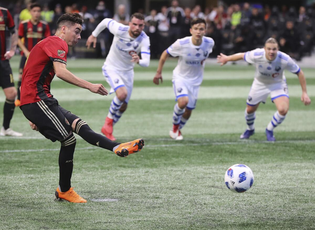 Atlanta United midfielder Miguel Almiron scores on a penalty kick during the second half of an MLS soccer game against Montreal Impact Saturday, April 28, 2018, in Atlanta.