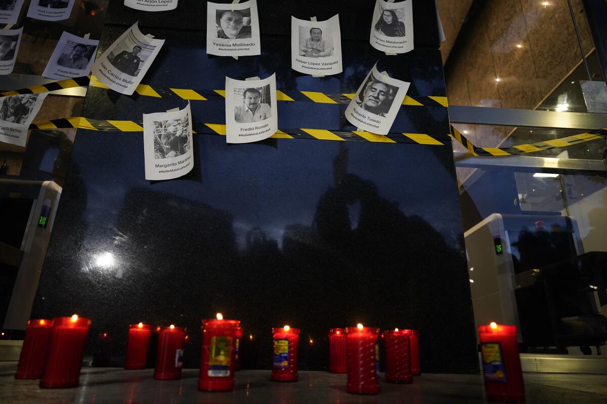 FILE - Photos of slain journalists are displayed on a wall during a vigil to protest the murder of journalist Fredid Roman, outside Mexico's Attorney General's office in Mexico City, Wednesday, Aug. 24, 2022. According to a report released Tuesday, Jan. 24, 2023, by the New York-based Committee to Protect Journalists, killings of journalists around the world jumped by 50% in 2022 compared to the previous year, driven largely by murders of reporters in the three deadliest countries: Ukraine, Mexico and Haiti. (AP Photo/Eduardo Verdugo, File)