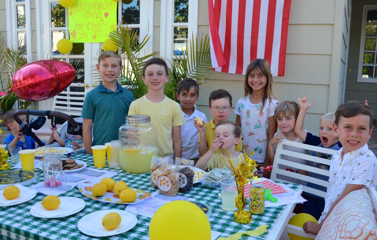 Lemonade stand creator Charlie Donohoe, center, with his crew of helpers.