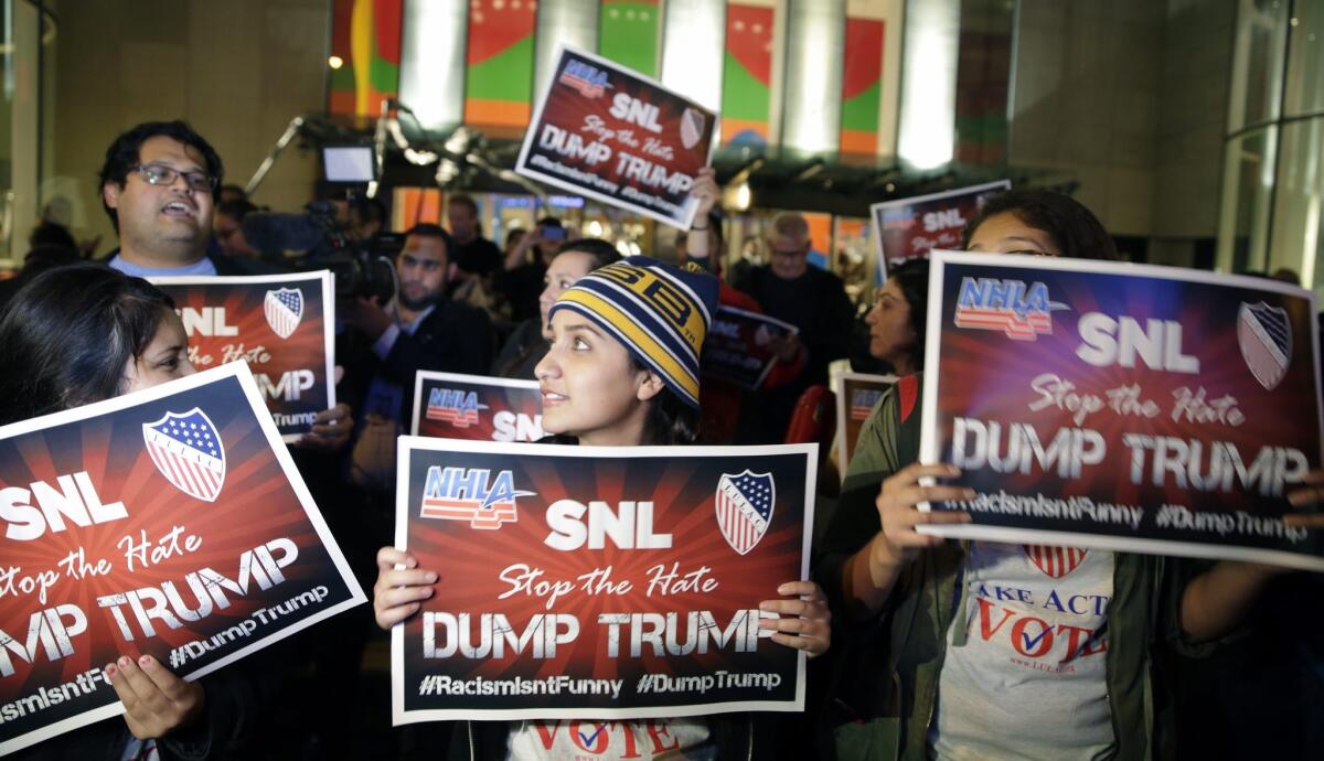 Protesters opposed to the appearance of Republican presidential candidate Donald Trump as guest host on this weekend's "Saturday Night Live" rally in New York.on Nov. 4, 2015.