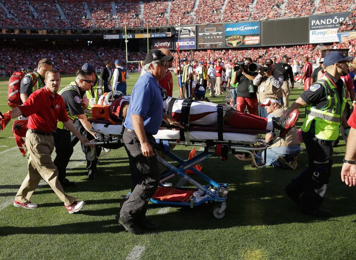 Calais Campbell of the Arizona Cardinals is carted off the field after being injured during a game against San Francisco on Sunday.