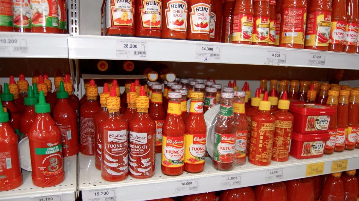 Vietnamese grocery stores like this one in Ho Chi Minh City are stocked with chili sauces.