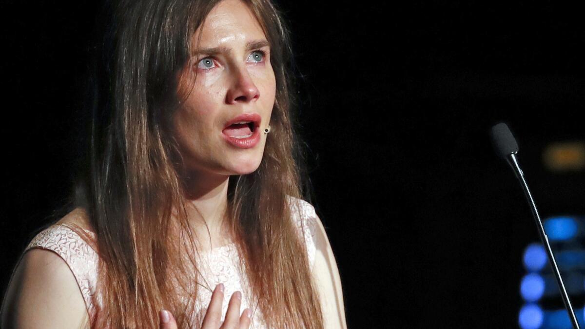 Amanda Knox gets emotional Saturday as she speaks at a criminal justice conference at the University of Modena in Italy.